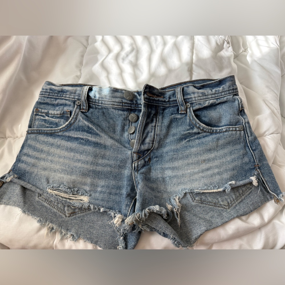 Free People low-mid rise shorts. Distressed with button fly closure. Size 25